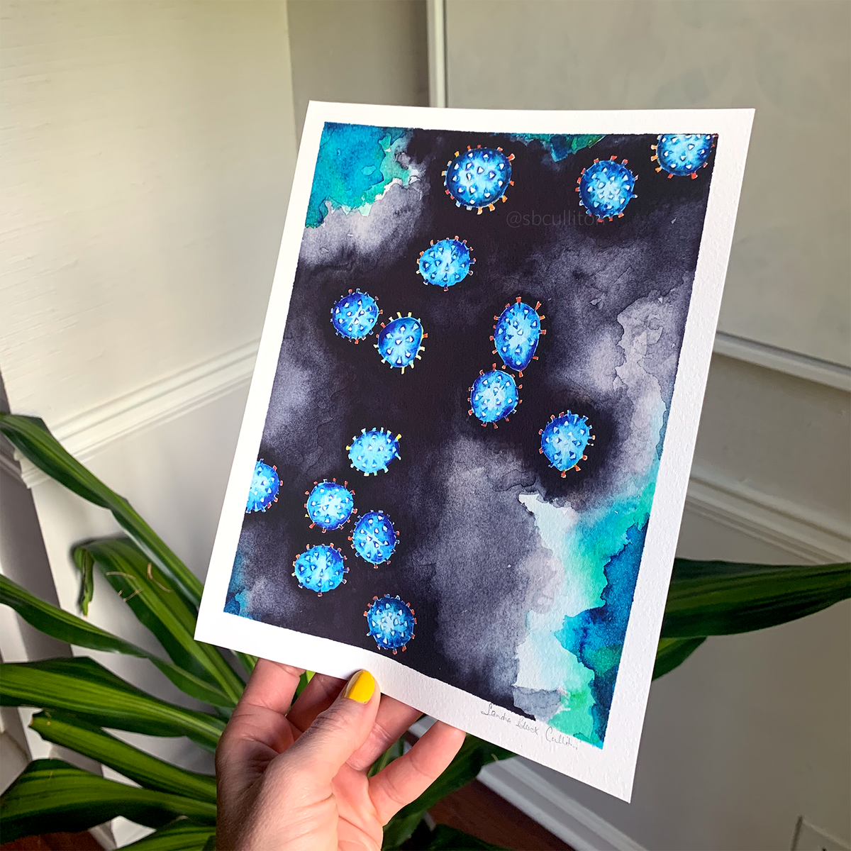 Coronavirus print held in hand.