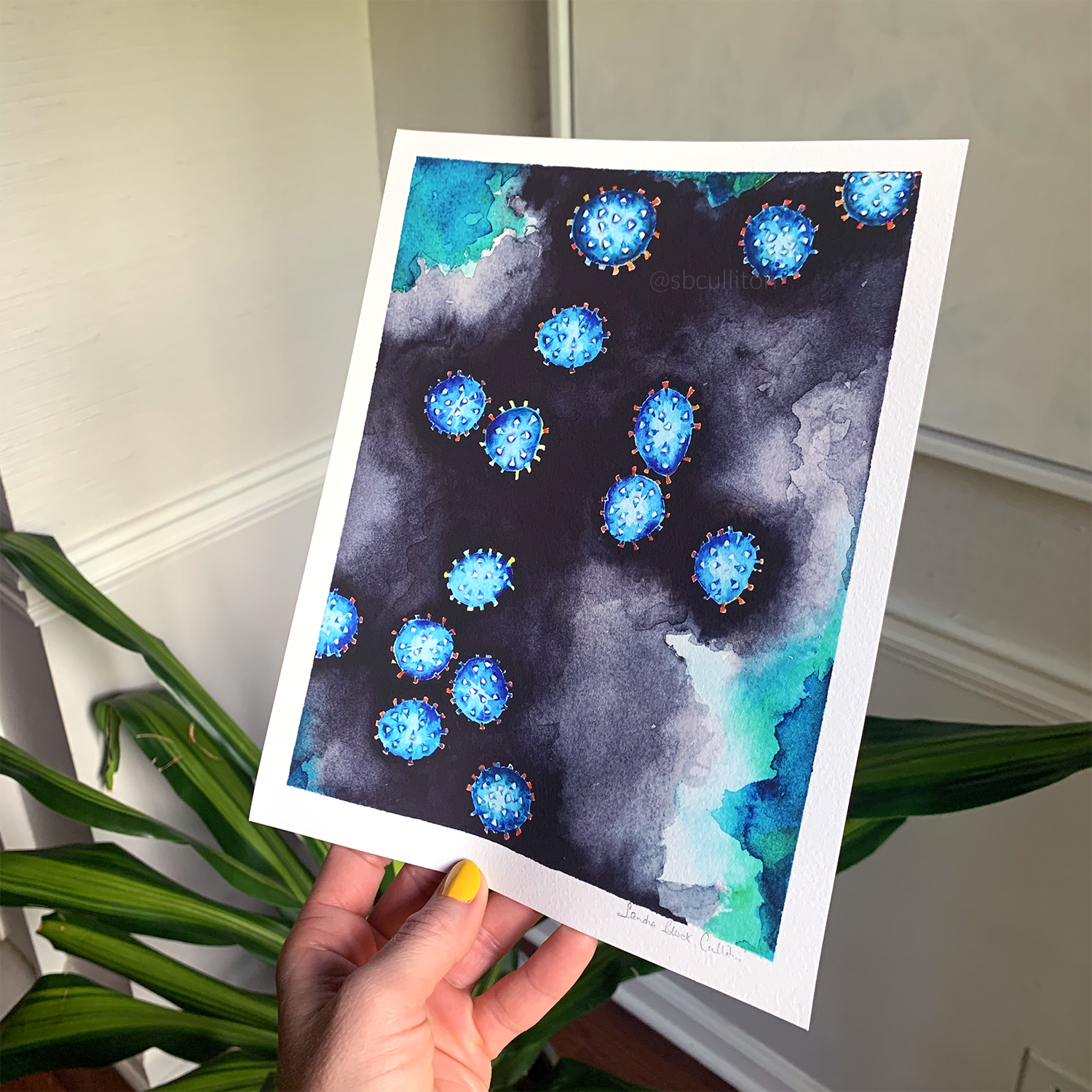 Coronavirus print held in hand.